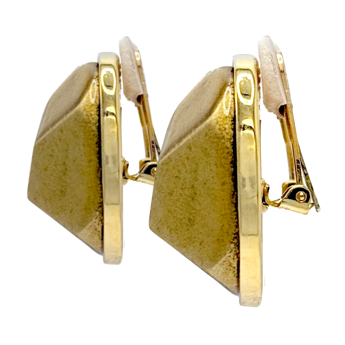 Side profile of Kenneth Jay Lane gold plated enamel earrings with sculptural depth