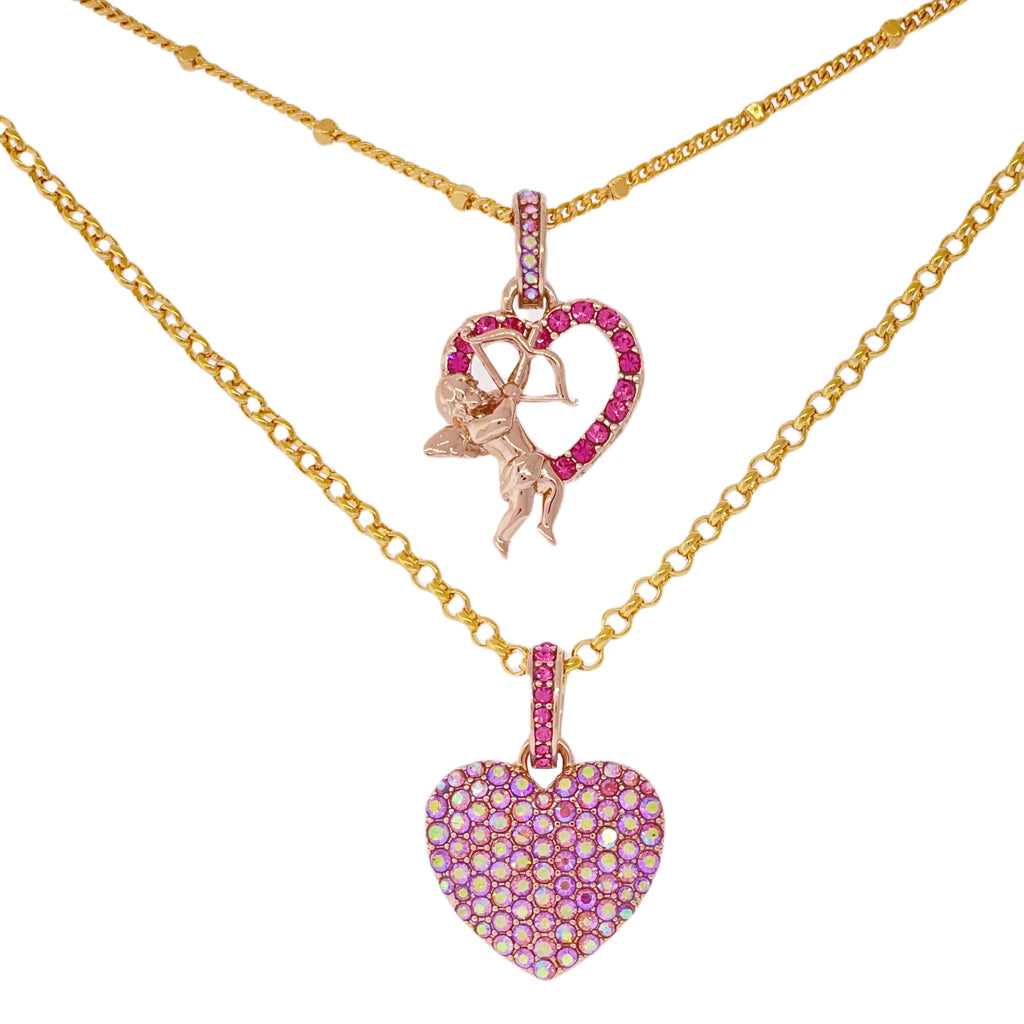 22k gold-plated Ritzy Couture DeLuxe necklace with two heart charms, cupid design and pink crystals, embodying Esme Hecht's signature American craftsmanship.