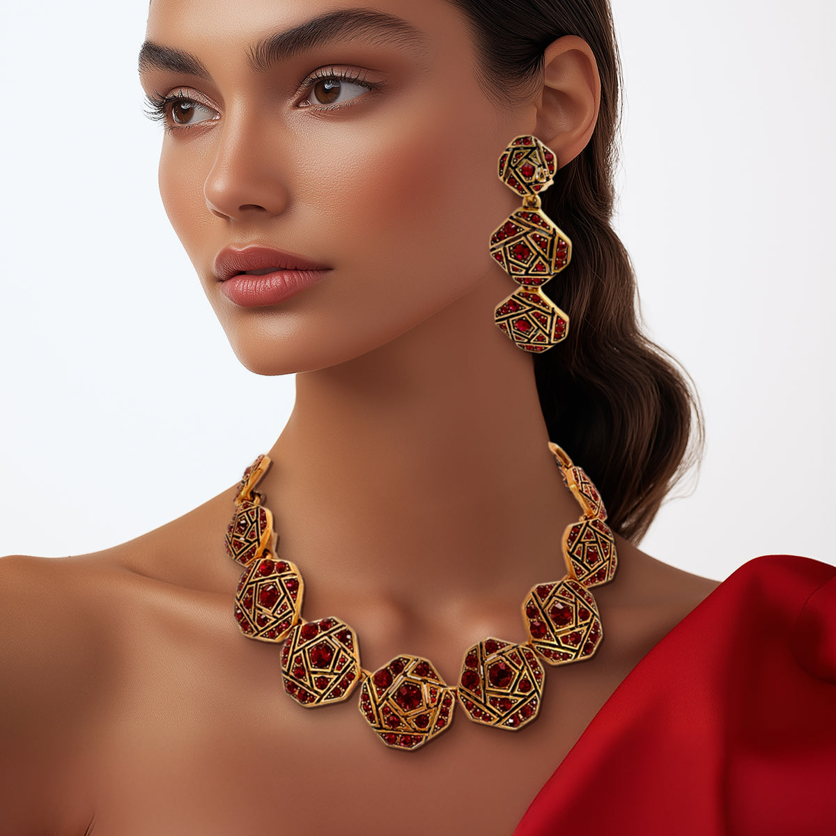 Full view of the Oscar de la Renta geometric mosaic necklace with red crystals and antique gold details, showcasing its adjustable 4.5-inch extender and secure lobster clasp