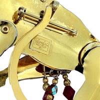 Back view of Lunch at The Ritz Organ Grinder Monkey Pin showing gold-tone metal, pin-back closure, and pendant bail.