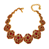 Full view of the Oscar de la Renta geometric mosaic necklace with red crystals and antique gold details, showcasing its adjustable 4.5-inch extender and secure lobster clasp