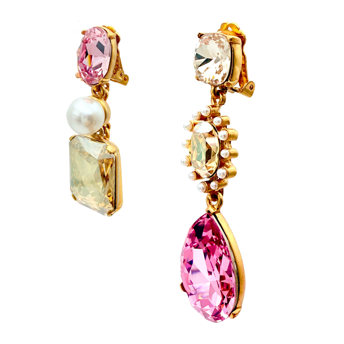 Close-up of Oscar de la Renta asymmetrical clip-on earrings featuring rose and light rose Austrian crystals with pearl accents, set in antique gold plating