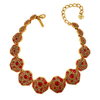 Full view of the Oscar de la Renta geometric mosaic necklace with red crystals and antique gold details, showcasing its adjustable 4.5-inch extender and secure lobster clasp